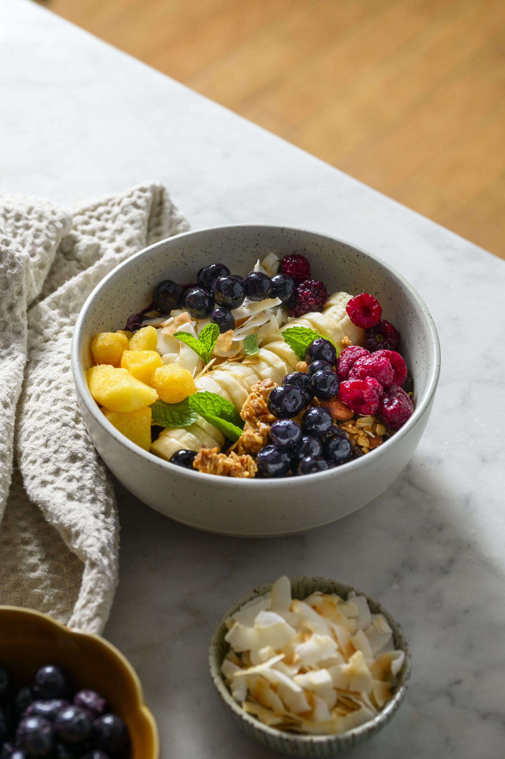 Fresh or frozen blueberry smoothie bowl with toppings